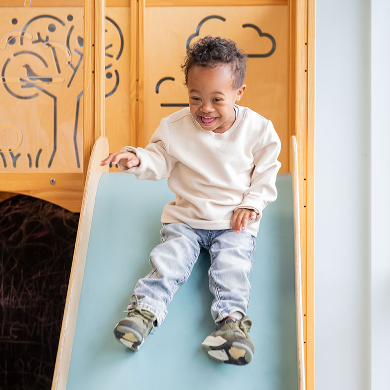 United Way of Greater Stark County Boy Sliding Down a Slide