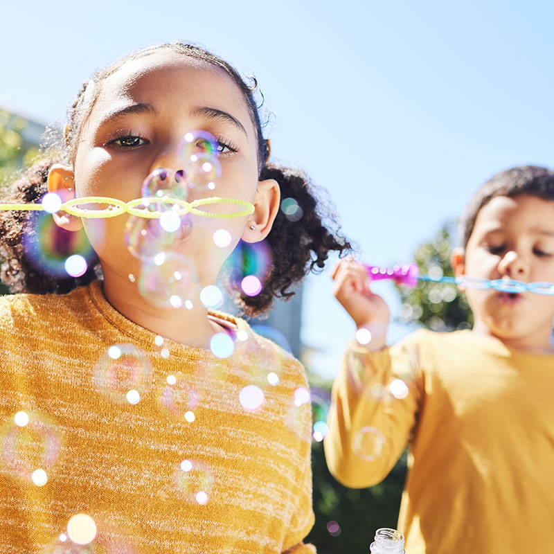 United Way of Greater Stark County Boy and Girl Blowing Bubbles