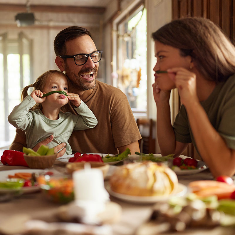 United Way of Greater Stark County Family Laughing at the Dinner Table
