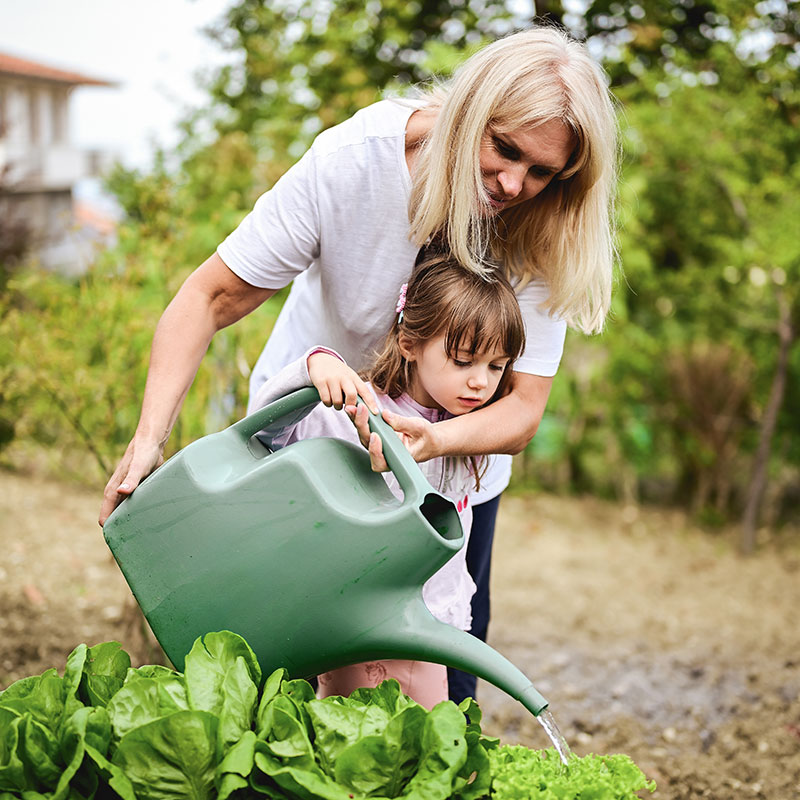 United Way of Greater Stark County Grandma and Girl Watering Plants